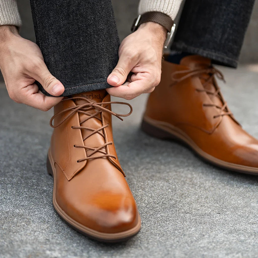 Man wearing brown leather boots